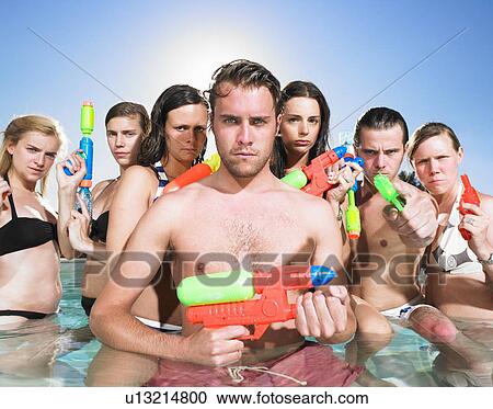 young people posing with water guns View Large Photo Image Stock Image - young people posing with water guns. Fotosearch