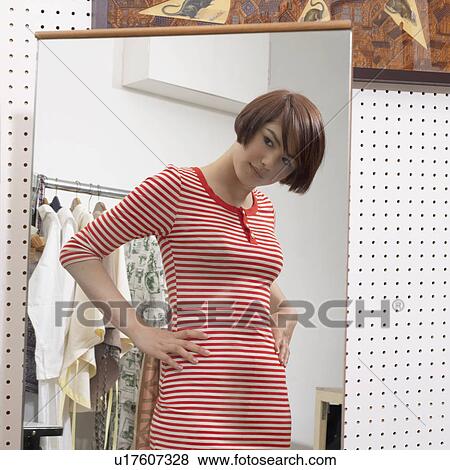 young woman in front of mirror View Large Photo Image Stock Photo - young woman in front of mirror. Fotosearch
