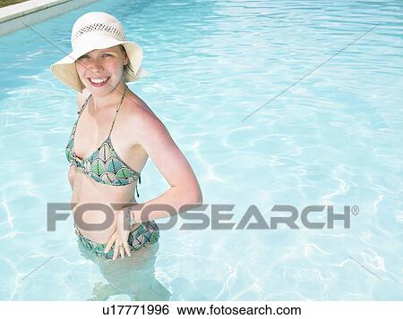 Stock Photograph - young woman in pool. Fotosearch