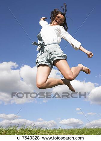 young woman jumping View Large Photo Image Stock Photo - young woman jumping. Fotosearch