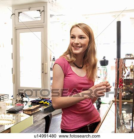 Stock Image - Young woman shopping. Fotosearch