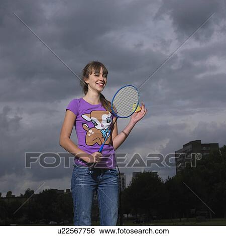 young woman with badminton racket View Large Photo Image Stock Photograph - young woman with badminton racket. Fotosearch