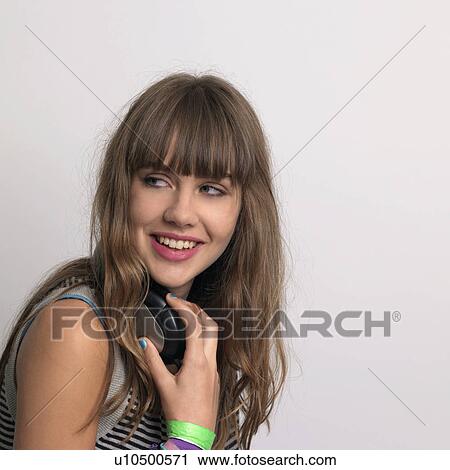 Young woman with headphones View Large Photo Image Stock Image - Young woman with headphones. Fotosearch