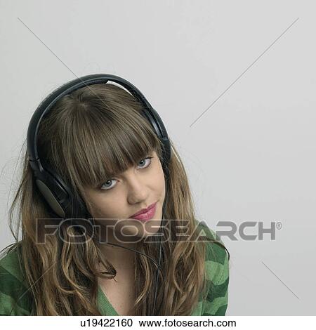 Young woman with headphones View Large Photo Image Stock Image - Young woman with headphones. Fotosearch