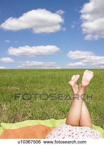 young womans legs in field View Large Photo Image Stock Photograph - young womans legs in field. Fotosearch