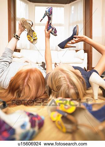 young women choosing shoes View Large Photo Image Picture - young women choosing shoes. Fotosearch