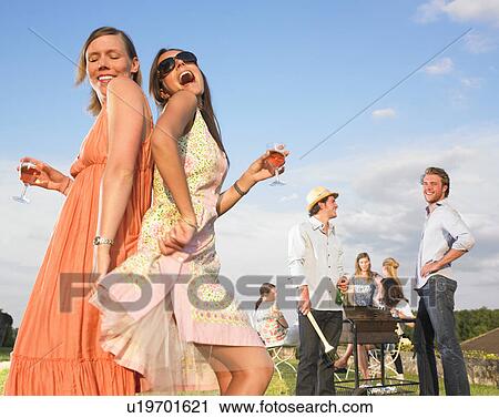young women dancing at barbecue View Large Photo Image Stock Image - young women dancing at barbecue. Fotosearch