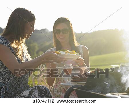 young women having barbecue View Large Photo Image Stock Image - young women having barbecue. Fotosearch