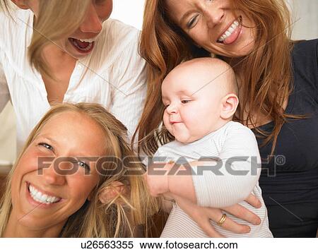 young women playing with baby View Large Photo Image Stock Photography - young women playing with baby. Fotosearch