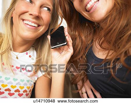 young women using phone View Large Photo Image Stock Photo - young women using phone. Fotosearch