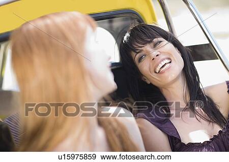2 Girl friends having fun and laughing View Large Photo Image Stock Photo - 2 Girl friends having fun and laughing. Fotosearch
