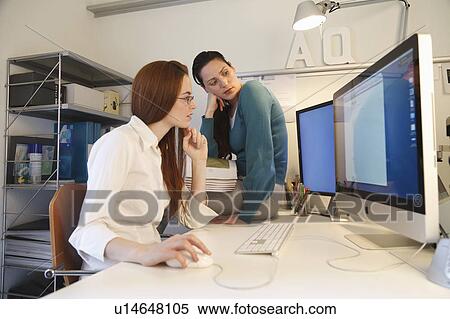 Stock Photography - 2 Woman working at the computer. Fotosearch