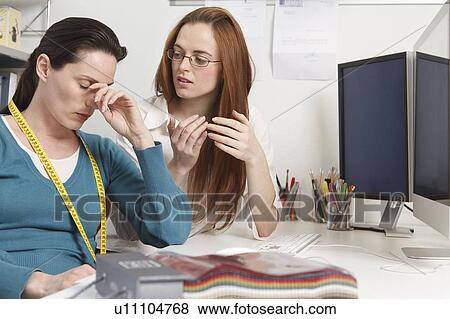 Stock Photo - 2 women having a discussion. Fotosearch