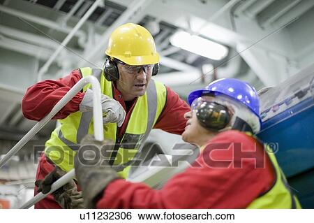 2 workers in engine room View Large Photo Image Stock Photograph - 2 workers in engine room. Fotosearch