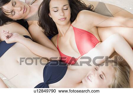 Stock Image -  3 girlfriends at Bikini party. Fotosearch