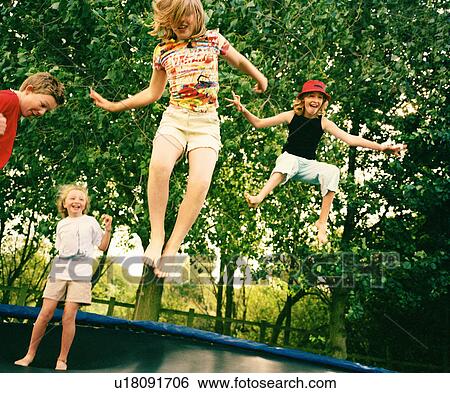 4 children leaping on trampoline View Large Photo Image Stock Photograph - 4 children leaping on trampoline. Fotosearch
