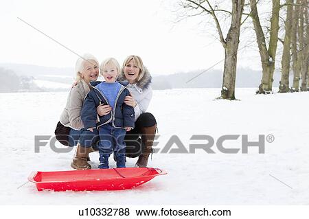 A boy, his Mum and Granny in the snow View Large Photo Image Stock Photo - A boy, his Mum and Granny in the snow. Fotosearch