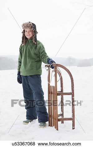 A boy with a sledge View Large Photo Image Stock Photo - A boy with a sledge. Fotosearch