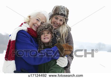 Stock Image - A family portrait in the snow. Fotosearch