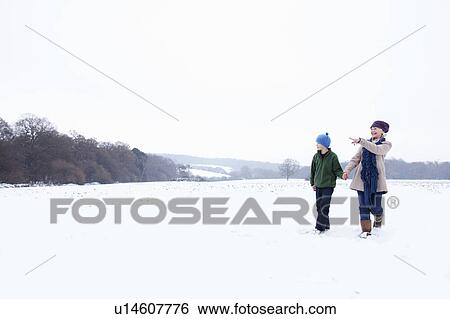 Stock Photograph - A Grandmother and her Grandson walking. Fotosearch