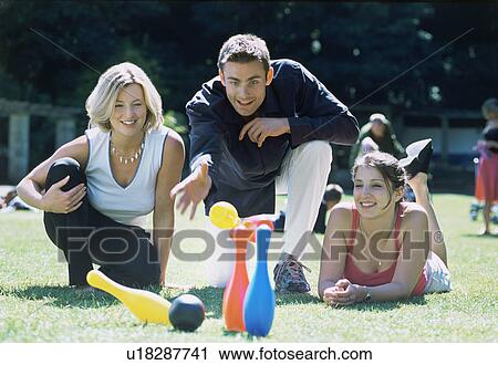 A group of friends playing skittles View Large Photo Image Stock Image - A group of friends playing skittles. Fotosearch