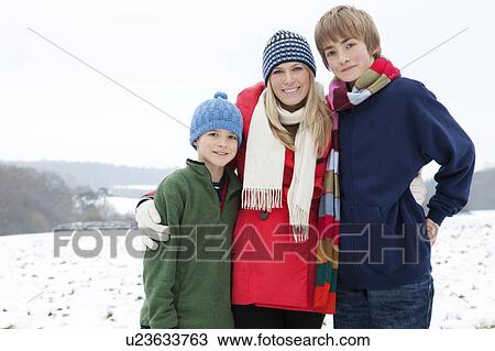 A mother and her sons in the snow View Large Photo Image Stock Image - A mother and her sons in the snow. Fotosearch