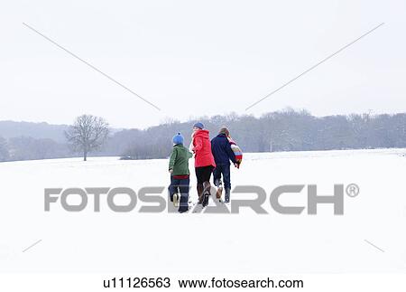 A Mother and Son running in the snow View Large Photo Image Stock Image - A Mother and Son running in the snow. Fotosearch