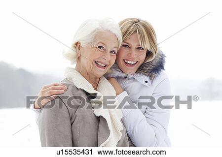 A portrait of two ladies in the snow View Large Photo Image Stock Image - A portrait of two ladies in the snow. Fotosearch