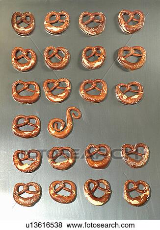 Stock Photo - A pretzel-style roll in between pretzels. Fotosearch
