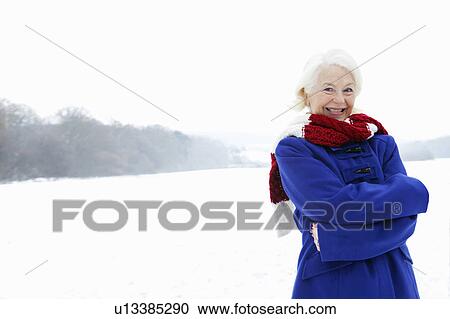 A senior female in a snowy landscape View Large Photo Image Stock Image - A senior female in a snowy landscape. Fotosearch