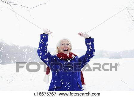 Stock Photo - A senior female in the snow. Fotosearch