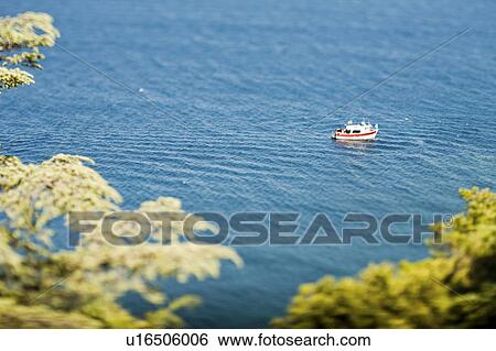 Aerial view of fishing boat off coast View Large Photo Image Stock Photograph - Aerial view of fishing boat off coast. Fotosearch