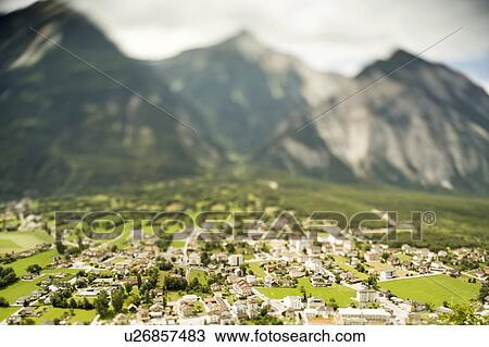 Aerial view of village by mountains View Large Photo Image Stock Image - Aerial view of village by mountains. Fotosearch