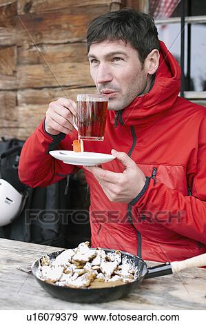 Alpinist drinking Tea View Large Photo Image Stock Photo - Alpinist drinking Tea. Fotosearch