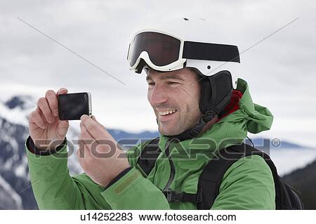 Alpinist taking Picture smiling View Large Photo Image Stock Image - Alpinist taking Picture smiling. Fotosearch