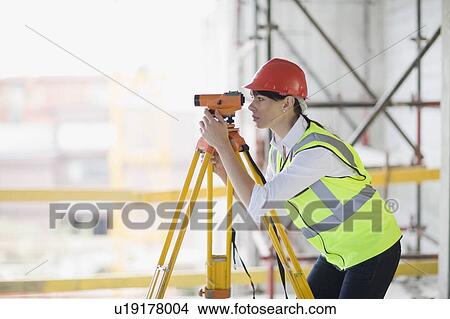 Architect doing measuring View Large Photo Image Picture - Architect doing measuring. Fotosearch