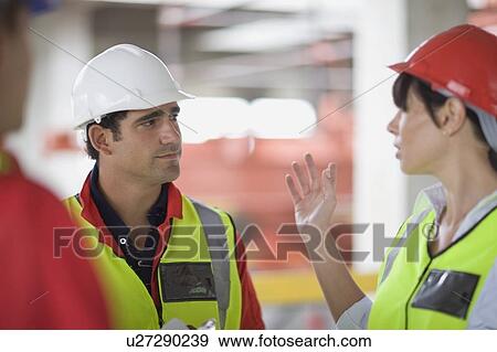 Architect talking to builder View Large Photo Image Stock Photo - Architect talking to builder. Fotosearch