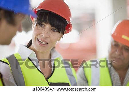 Architect talking to builders View Large Photo Image Stock Photo - Architect talking to builders. Fotosearch
