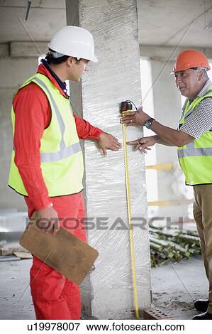 Architect talking to building worker View Large Photo Image Stock Photo - Architect talking to building worker. Fotosearch