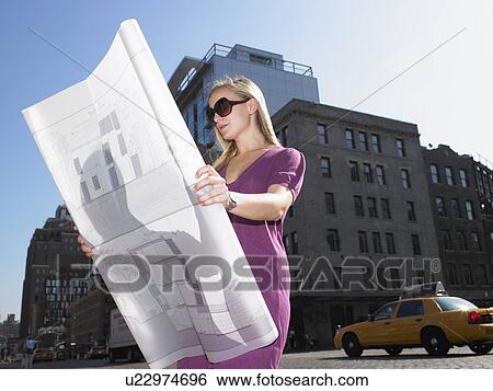 Architect with blue prints in the street View Large Photo Image Stock Photograph - Architect with blue prints in the street. Fotosearch
