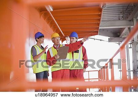 Stock Photo - Architects and builders at work. Fotosearch