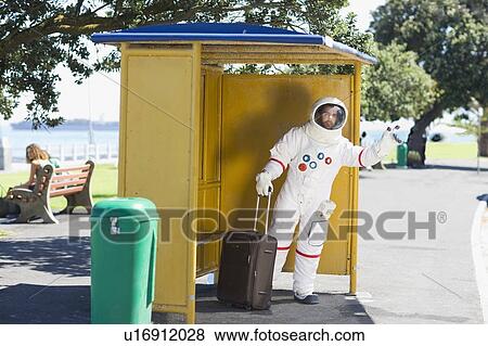 Stock Photo - Astronaut waiting for the shuttle. Fotosearch