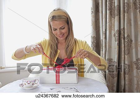 Attractive female with birthday gift View Large Photo Image Stock Image - Attractive female with birthday gift. Fotosearch