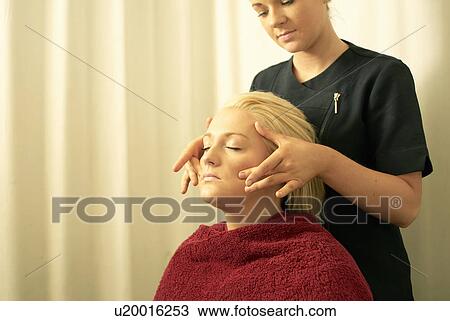 Beautician giving face massage View Large Photo Image Stock Image - Beautician giving face massage. Fotosearch