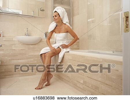 Beautiful woman looking after her body View Large Photo Image Stock Photo - Beautiful woman looking after her body. Fotosearch