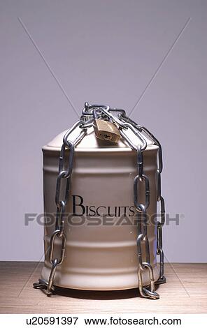 Stock Photo - Biscuit jar chained up. Fotosearch