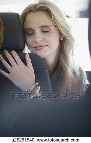 Blond girl sleeping in car View Large Photo Image Stock Image - Blond girl sleeping in car. Fotosearch