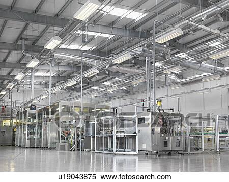 Stock Photography - Bottling machinery in plant. Fotosearch