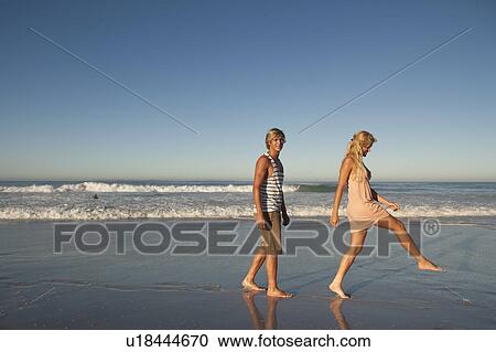 Stock Image - Boy and Girl splashing. Fotosearch