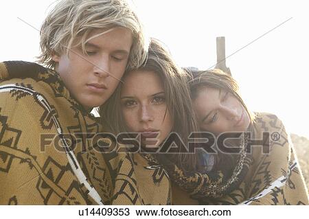 Boy and girls covered in blanket freezing View Large Photo Image Stock Image - Boy and girls covered in blanket freezing. Fotosearch